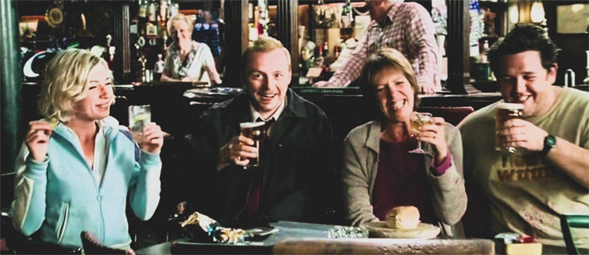 An image of four people holding pint glasses. The image is from the movie Shaun of the Dead.